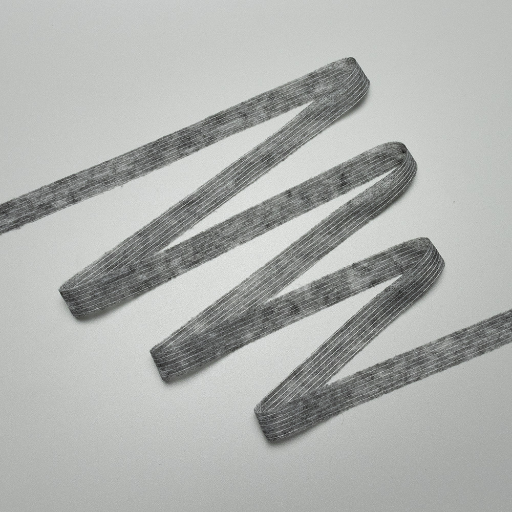 Buy online: Non-woven tape, straight, cm, 1.5 thread-stitched melange (Kufner) grey